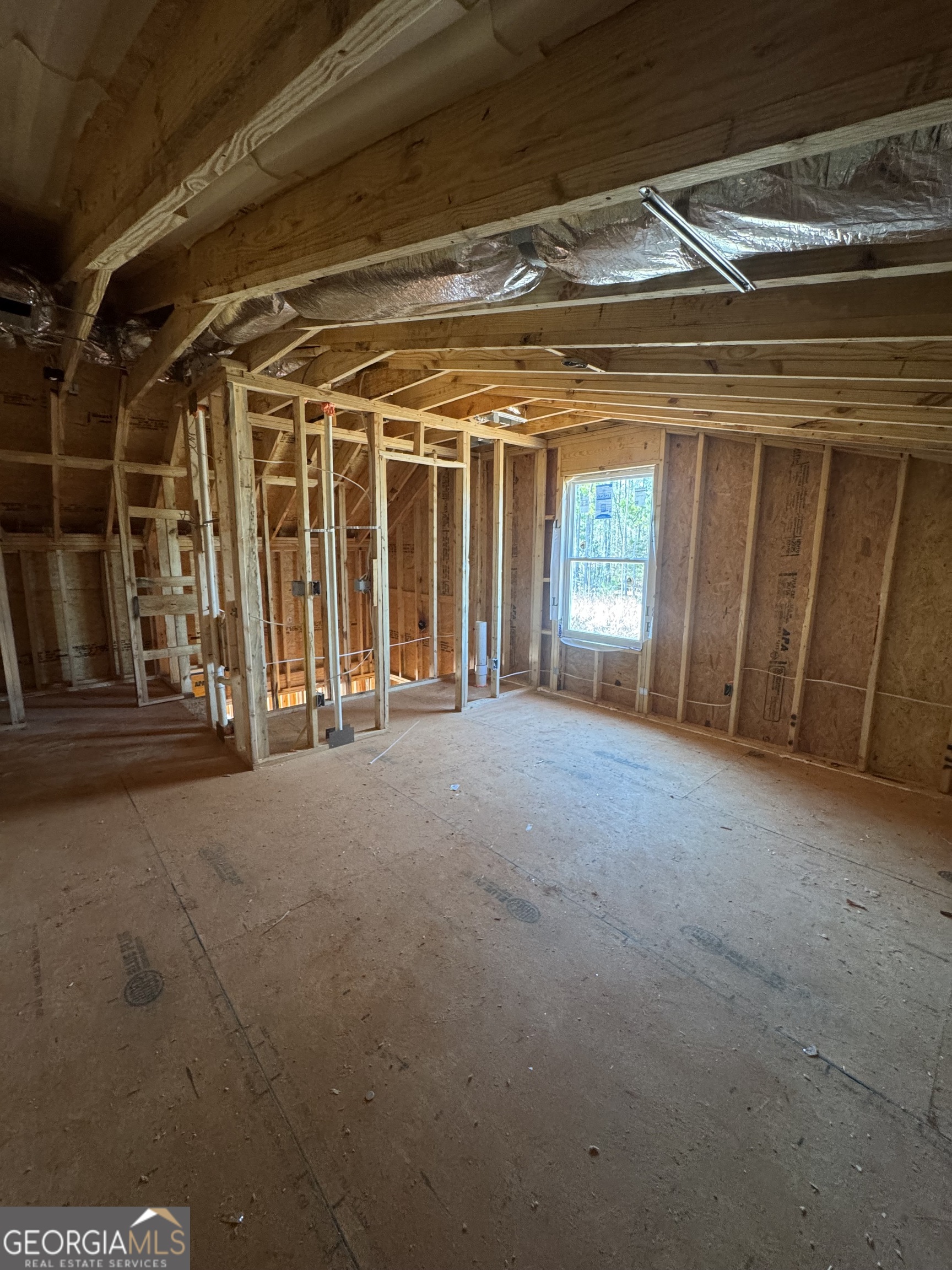 431 Andrews Mill Road Greenville, GA 30222 - Photo 5 of 8 a view of an empty room with wooden floor and windows
