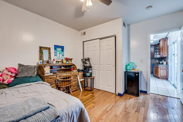 a bed room with a bed and a desk