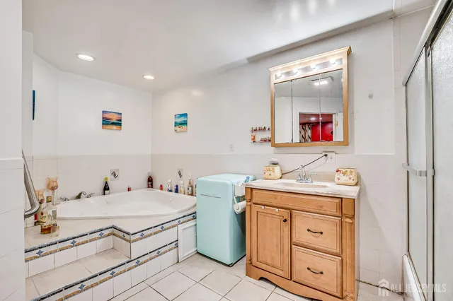 a view of a hallway with closet and a potted plant
