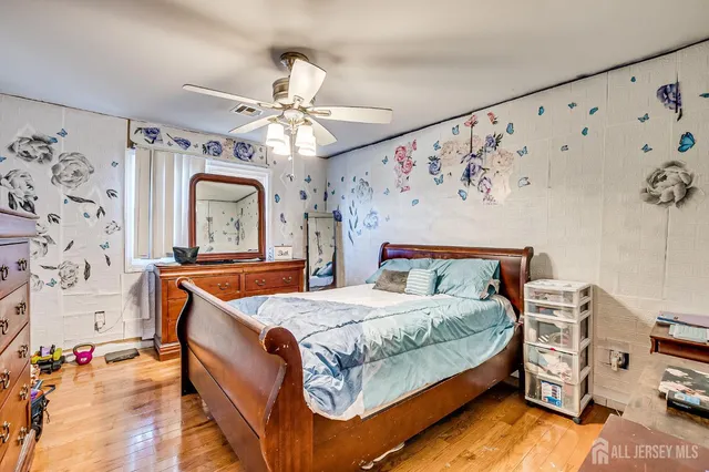 a bed room with a bed and a chandelier