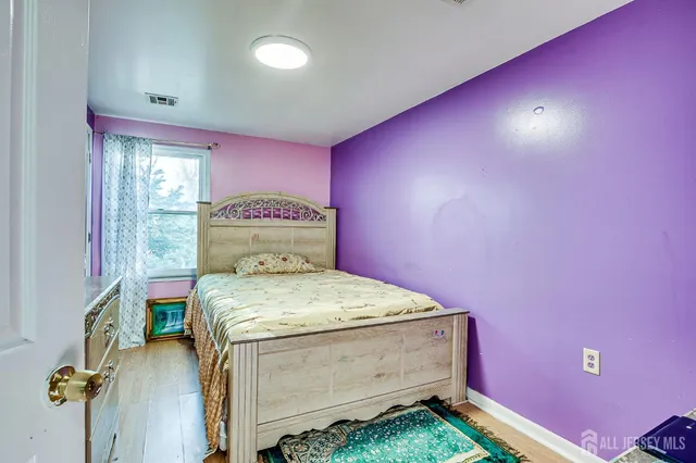 a view of a dining room with furniture and a chandelier