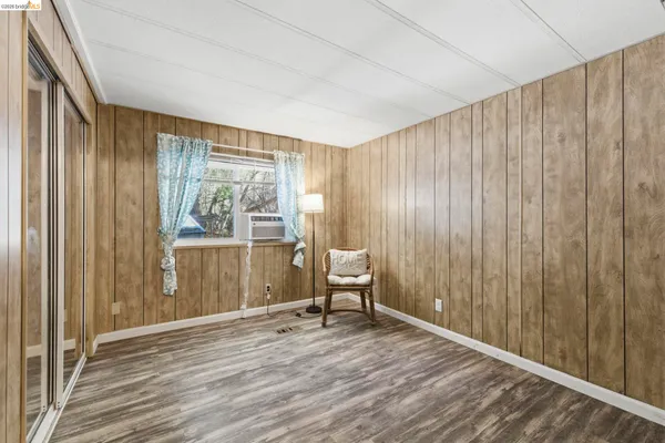 a living room filled with furniture and a window
