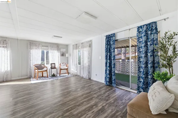 a view of livingroom with furniture and hardwood floor