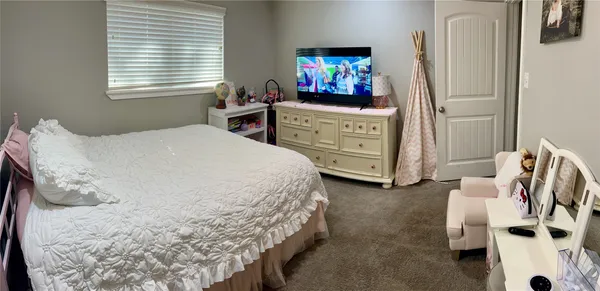 a bedroom with a bed and furniture