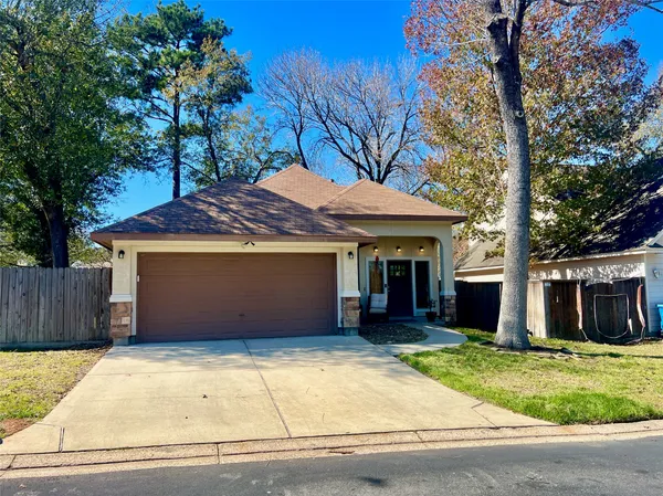 a view of a house with a garage