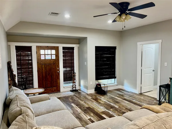 a view of a livingroom with furniture and windows