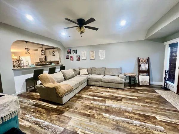a living room with furniture and a large window
