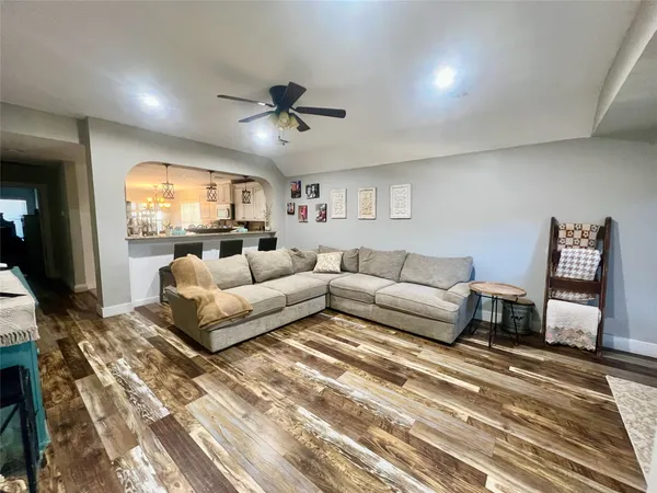 a living room with furniture and a large window