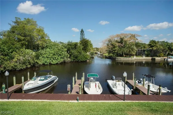 a view of a lake with houses in the background