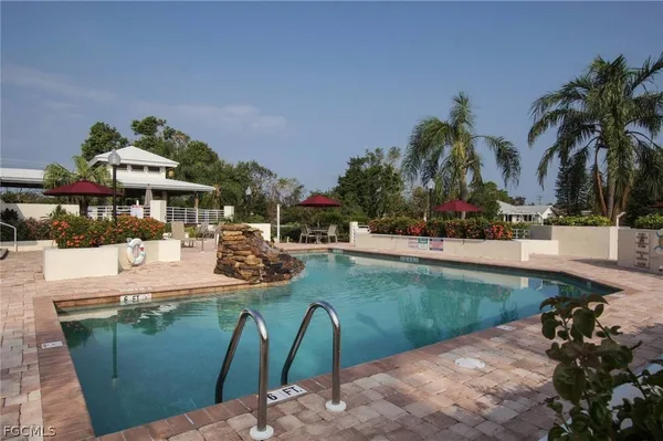 a view of a swimming pool with a patio