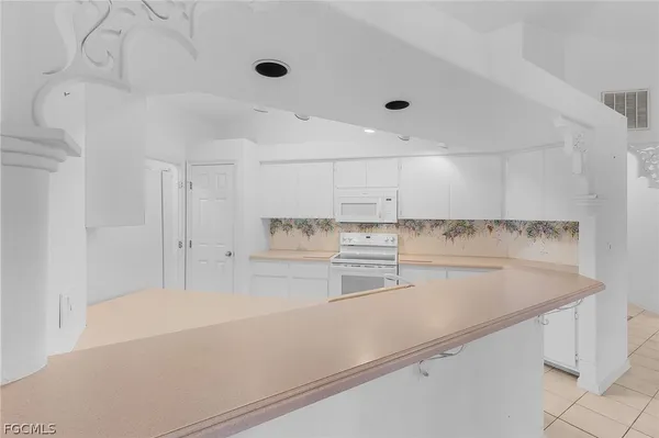 a view of a kitchen with a sink