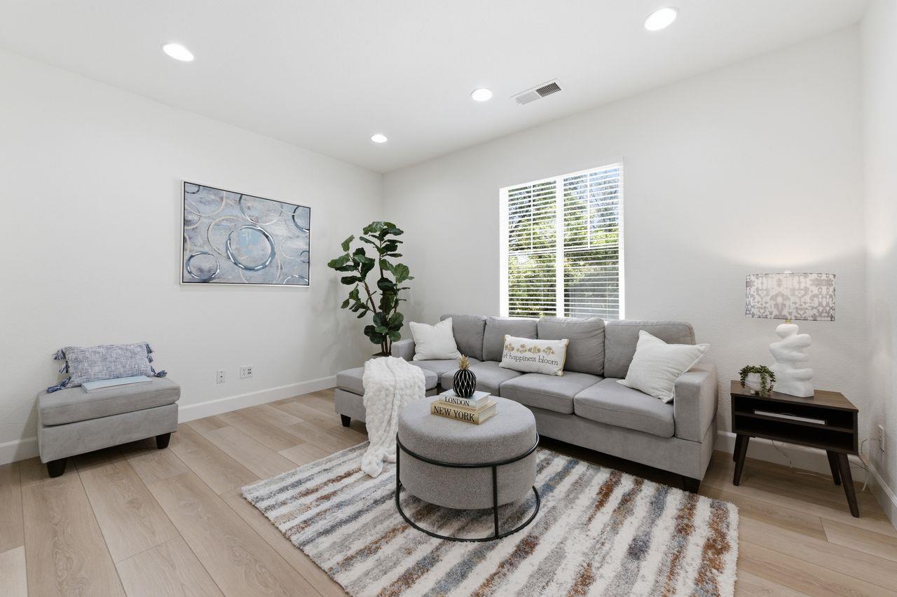 698 West Rico Way Tracy, CA 95391 - Photo 19 of 38 a living room with furniture and a large window