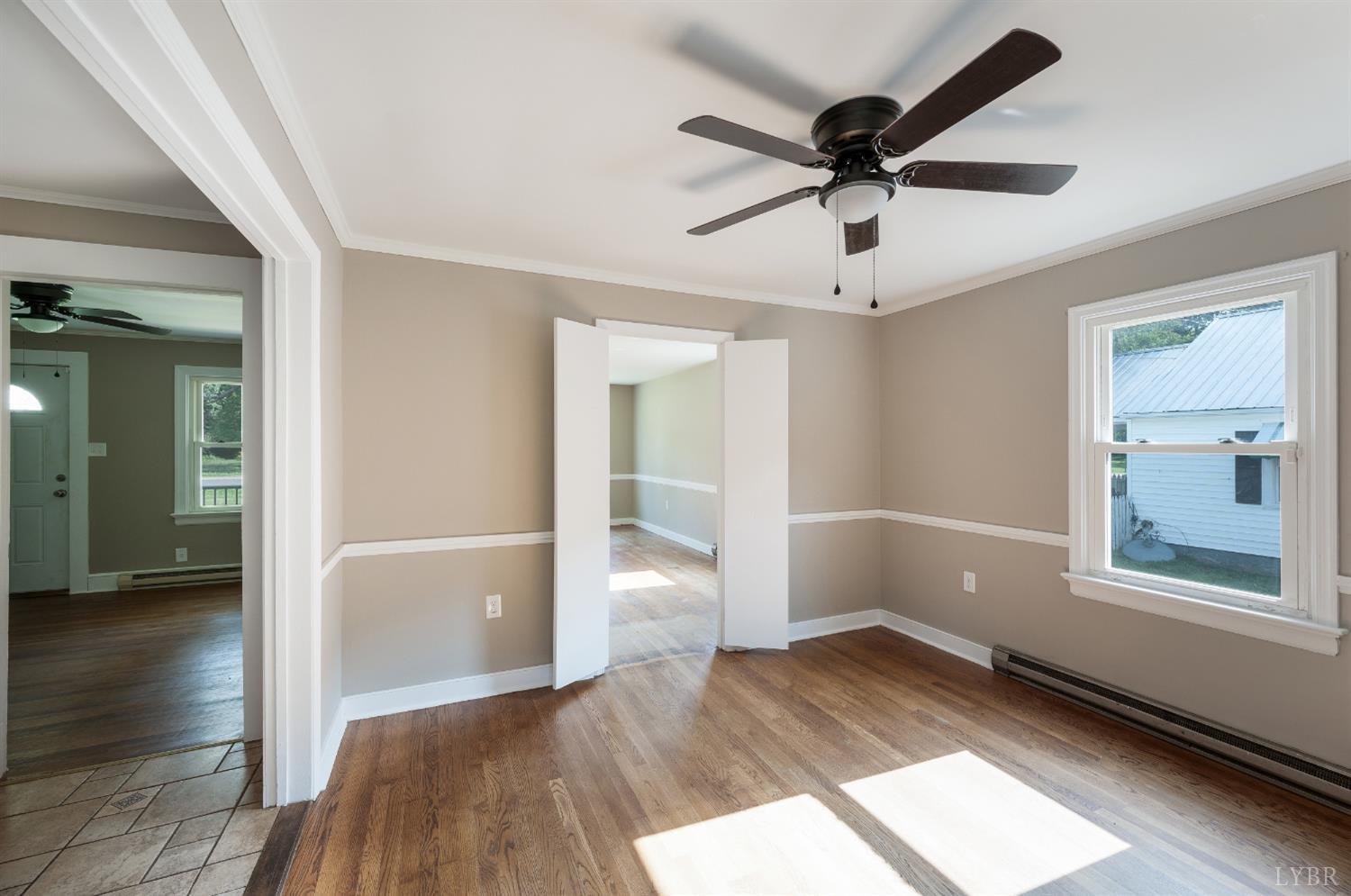 4550 Pumping Station Road Appomattox, VA 24522 - Photo 11 of 34 wooden floor in an empty room with a window