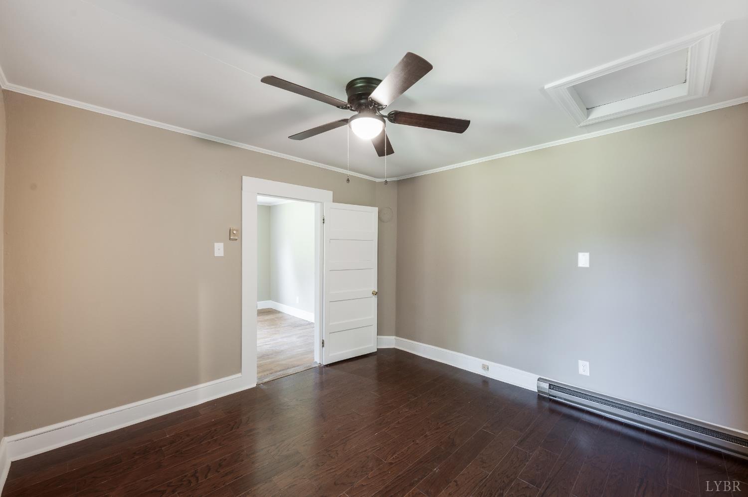 4550 Pumping Station Road Appomattox, VA 24522 - Photo 23 of 34 a view of an empty room with wooden floor and a window