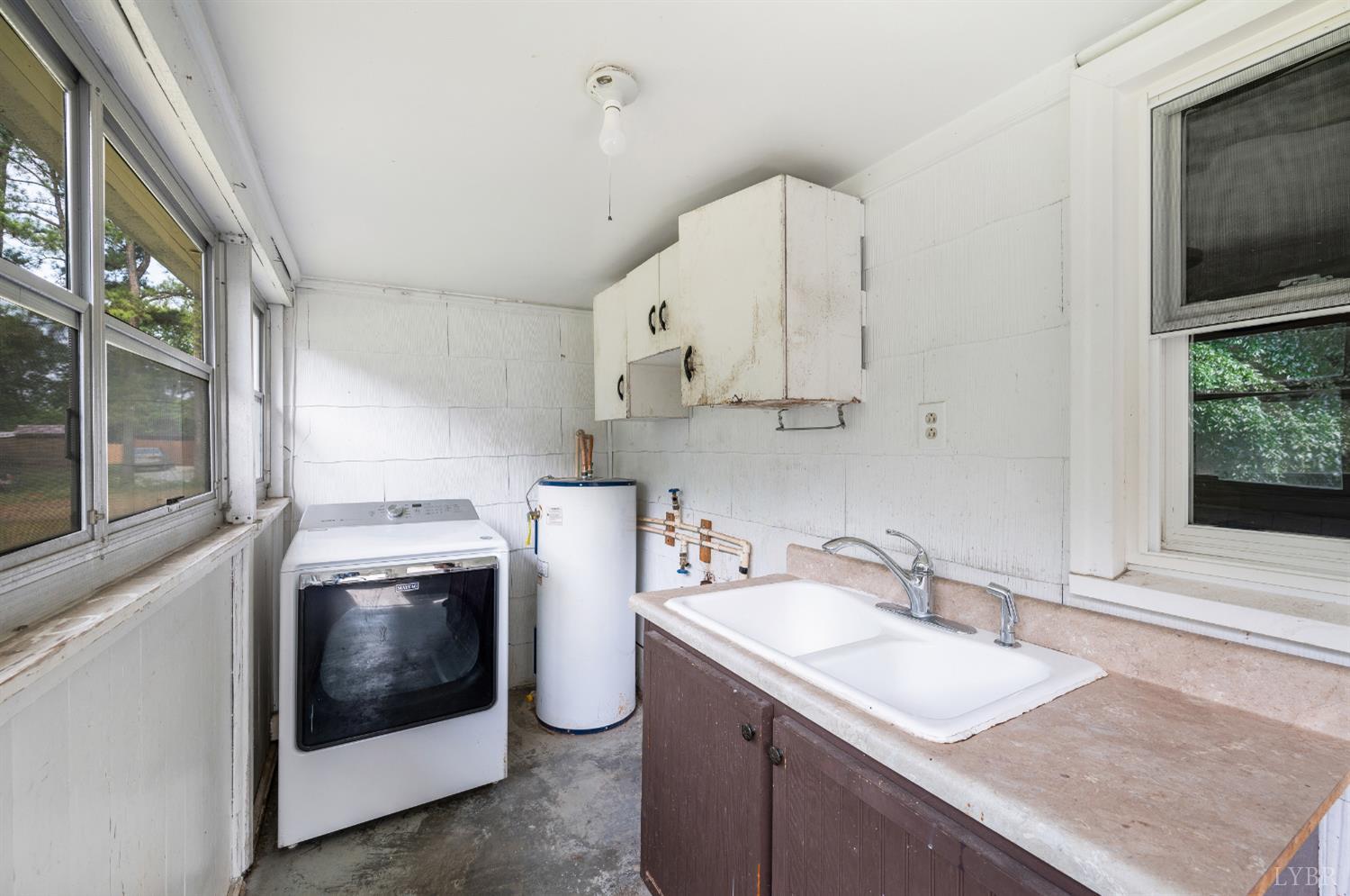4550 Pumping Station Road Appomattox, VA 24522 - Photo 27 of 34 a kitchen with a sink a stove and cabinets