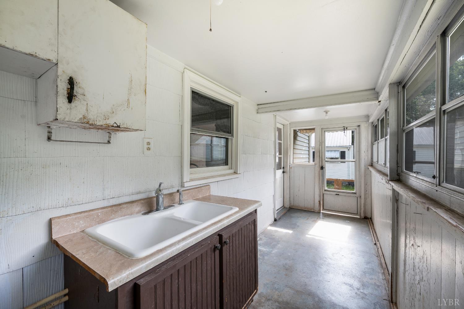 4550 Pumping Station Road Appomattox, VA 24522 - Photo 28 of 34 a kitchen with stainless steel appliances granite countertop a sink stove and refrigerator