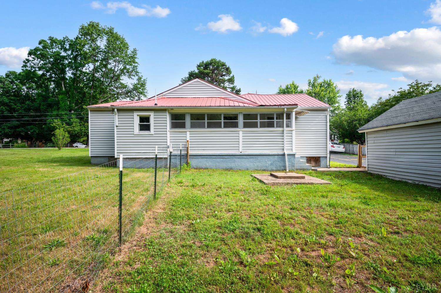 4550 Pumping Station Road Appomattox, VA 24522 - Photo 31 of 34 a backyard of a house with table and chairs