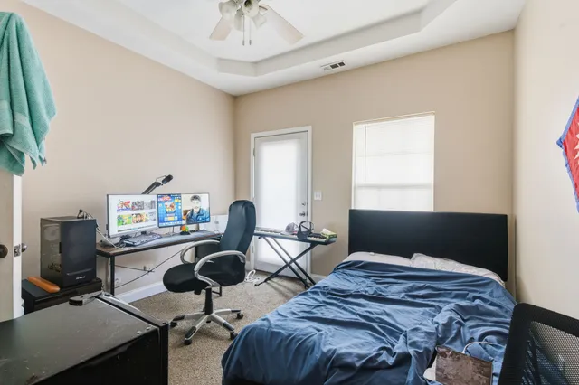 a bedroom with furniture and a window