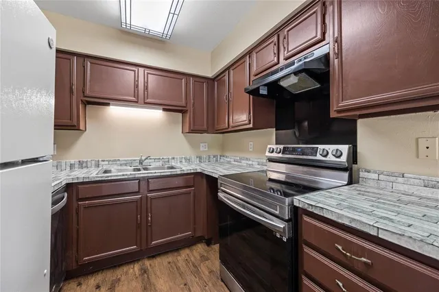 a kitchen with a stove and a sink