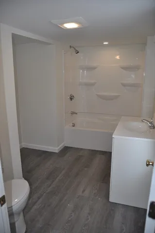 a bathroom with a sink and toilet
