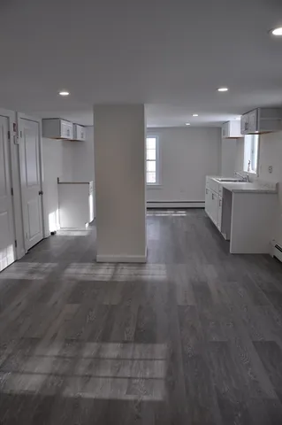 a view of a kitchen with a sink and a window