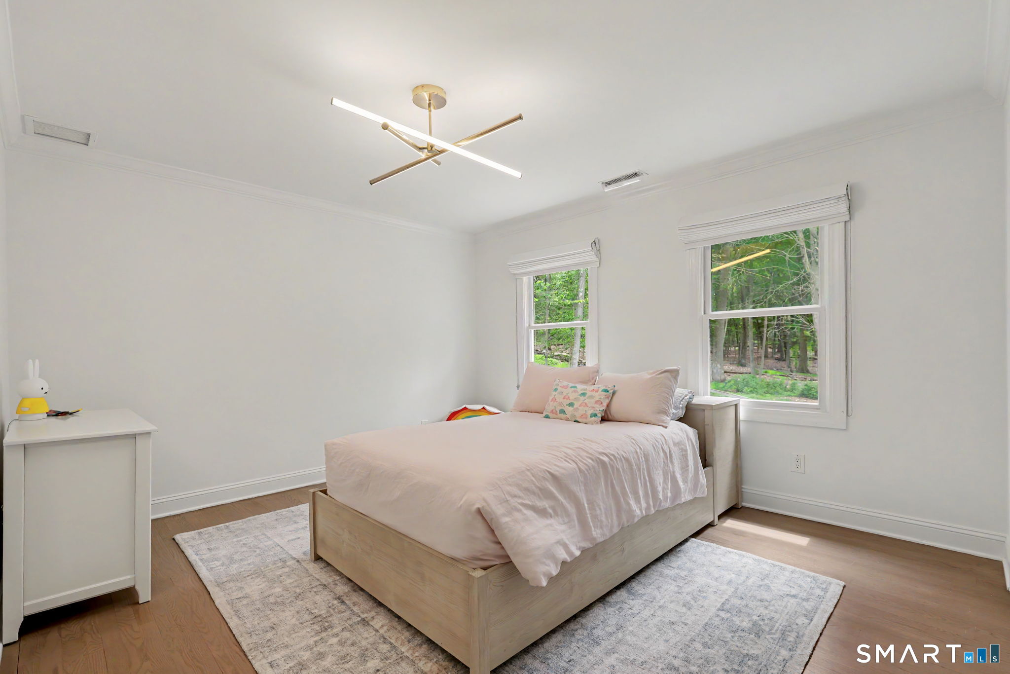 10 Side Hill Road Westport, CT 06880 - Photo 31 of 40 a bedroom with a bed and a window