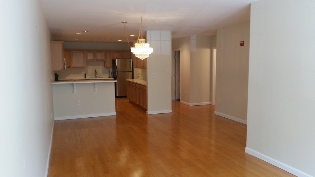 974 Main Street, Unit 25 Wakefield, MA 01880 - Photo 12 of 28 a view of a kitchen with a sink and dishwasher top oven
