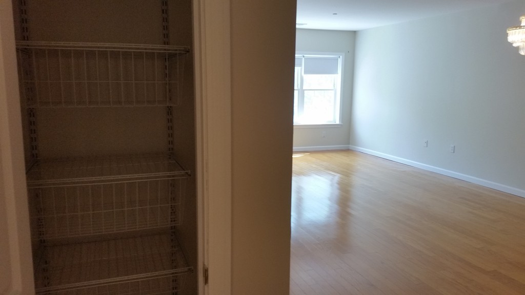 974 Main Street, Unit 25 Wakefield, MA 01880 - Photo 14 of 28 a view of hallway with wooden floor