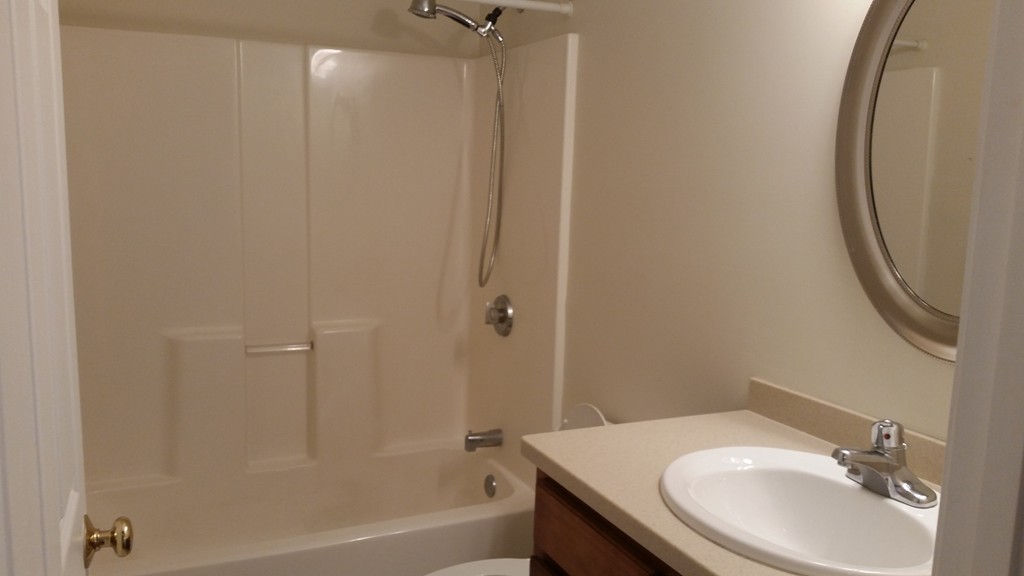 974 Main Street, Unit 25 Wakefield, MA 01880 - Photo 15 of 28 a bathroom with a sink and a mirror