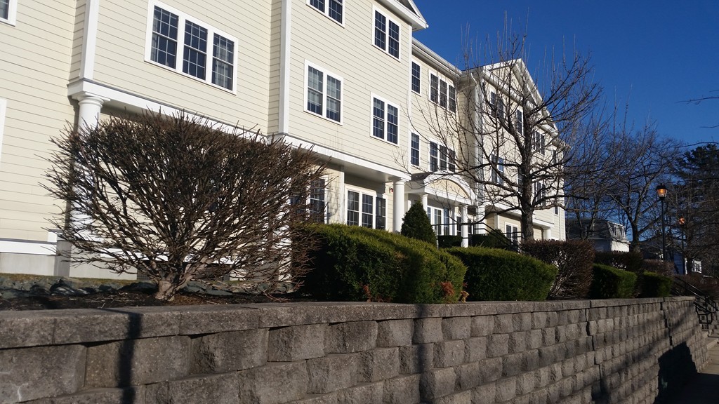 974 Main Street, Unit 25 Wakefield, MA 01880 - Photo 22 of 28 a view of a house with a yard