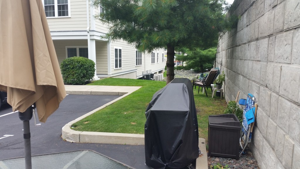 974 Main Street, Unit 25 Wakefield, MA 01880 - Photo 27 of 28 a view of a backyard with sitting area