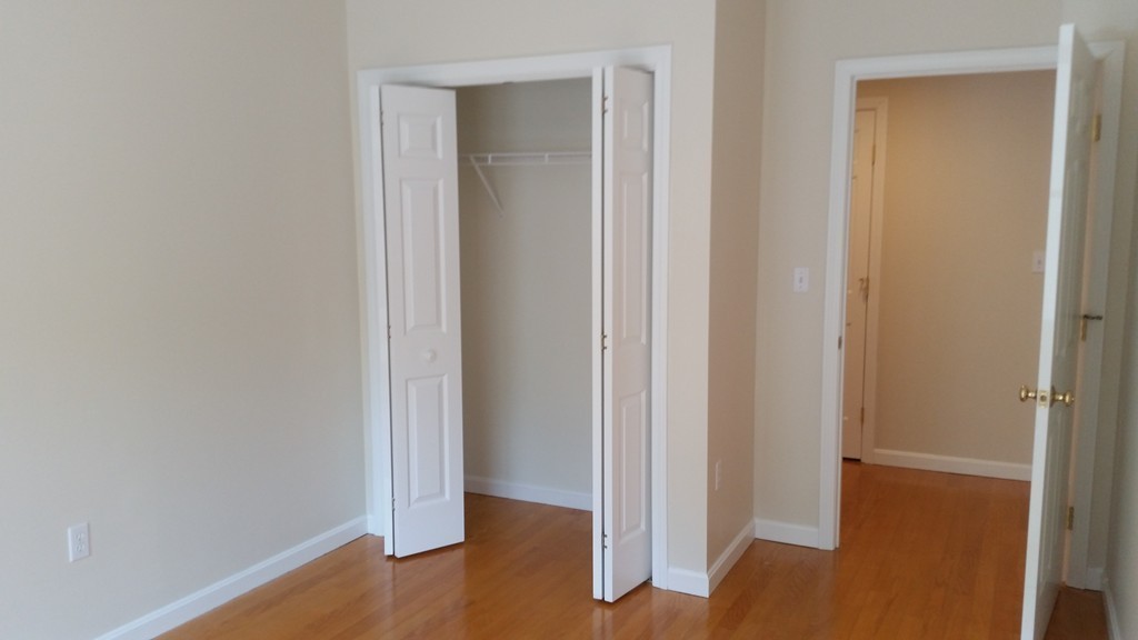 974 Main Street, Unit 25 Wakefield, MA 01880 - Photo 6 of 28 a view of a hallway with wooden floor