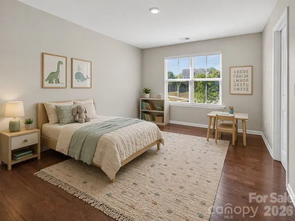 a spacious bathroom with a granite countertop sink a toilet and a shower