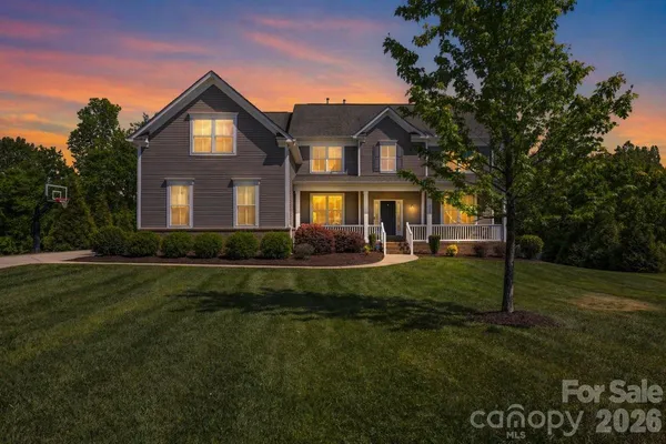 a kitchen with stainless steel appliances granite countertop a stove a sink dishwasher a refrigerator and a microwave oven