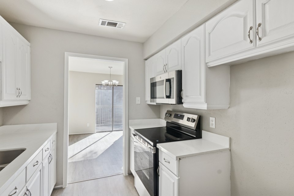 9707 Richmond Avenue, Unit 98 Houston, TX 77063 - Photo 15 of 24 a kitchen with a sink stove and cabinets