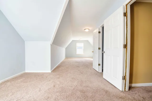 a view of a hallway with white walls