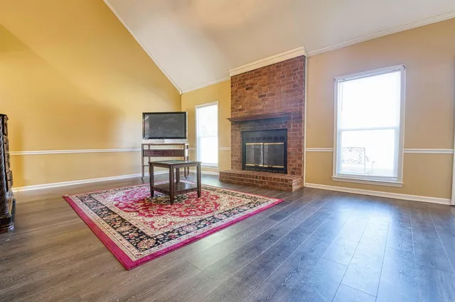 a living room with furniture and a rug