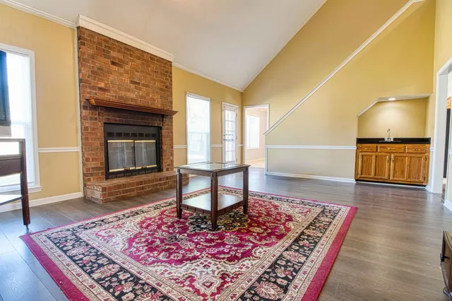 a living room with a rug