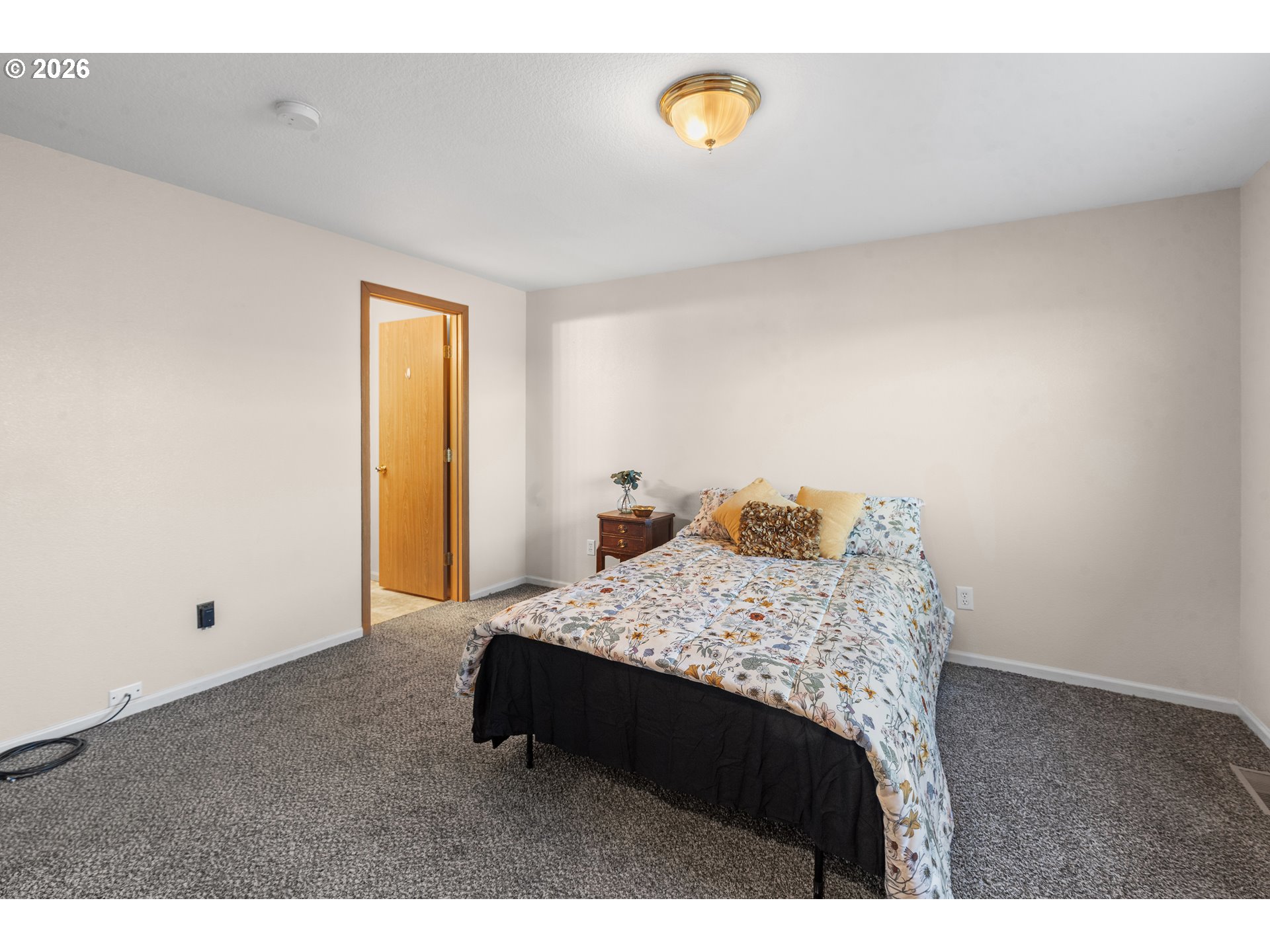 1314 Southwest 11th Court Pendleton, OR 97801 - Photo 13 of 30 a bedroom with a bed and a window