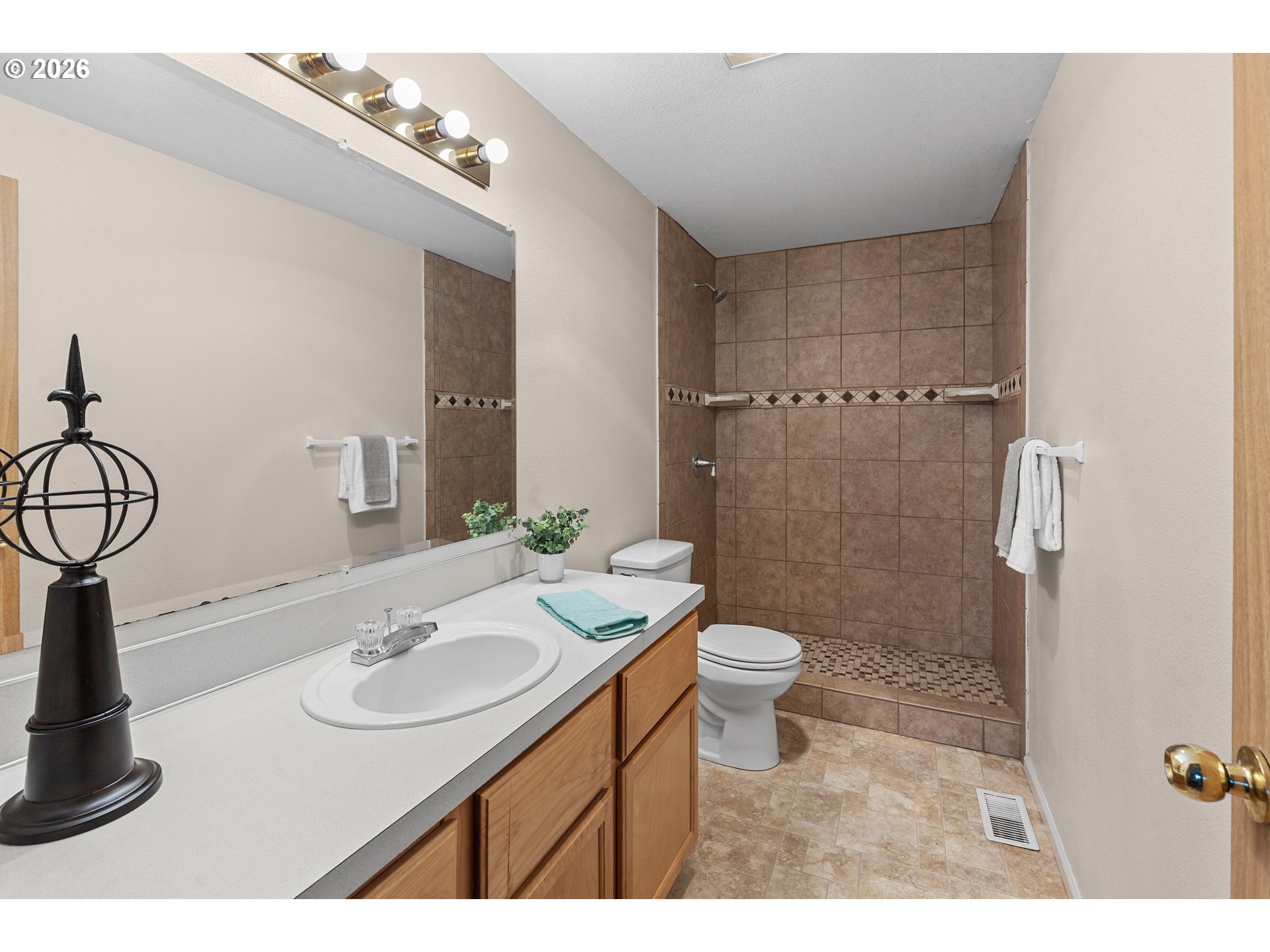 1314 Southwest 11th Court Pendleton, OR 97801 - Photo 14 of 30 a bathroom with a sink a toilet and shower