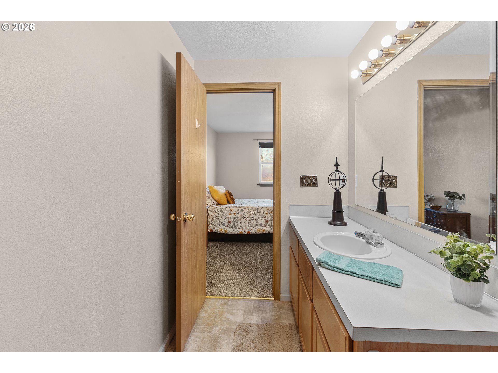 1314 Southwest 11th Court Pendleton, OR 97801 - Photo 15 of 30 a en suite bathroom with a granite countertop sink and a mirror