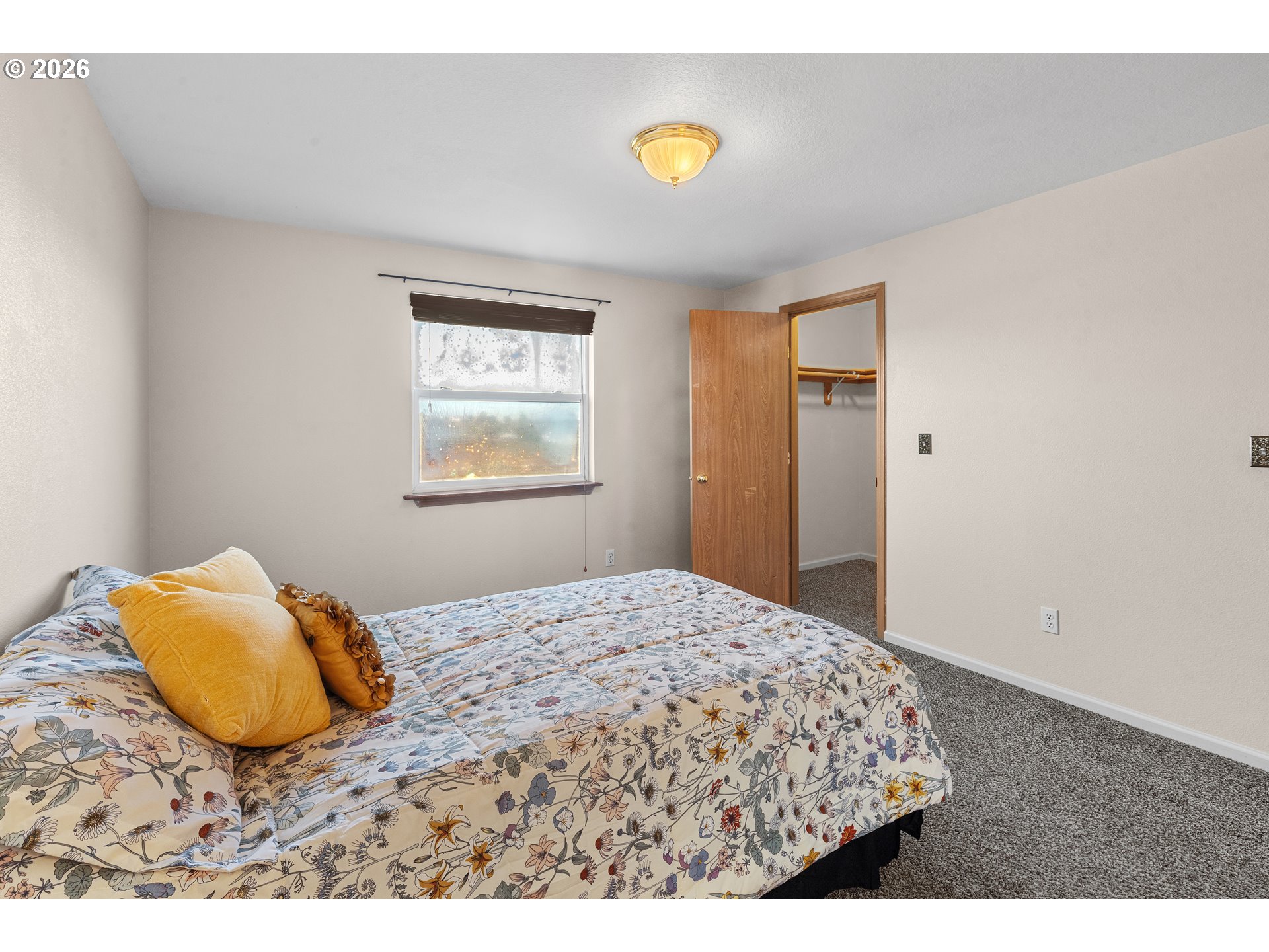 1314 Southwest 11th Court Pendleton, OR 97801 - Photo 16 of 30 a bedroom with a bed and a window