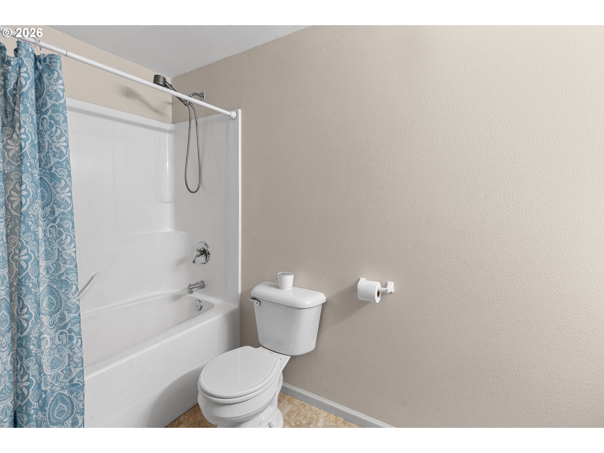 1314 Southwest 11th Court Pendleton, OR 97801 - Photo 20 of 30 a white toilet sitting next to a bath tub and a shower
