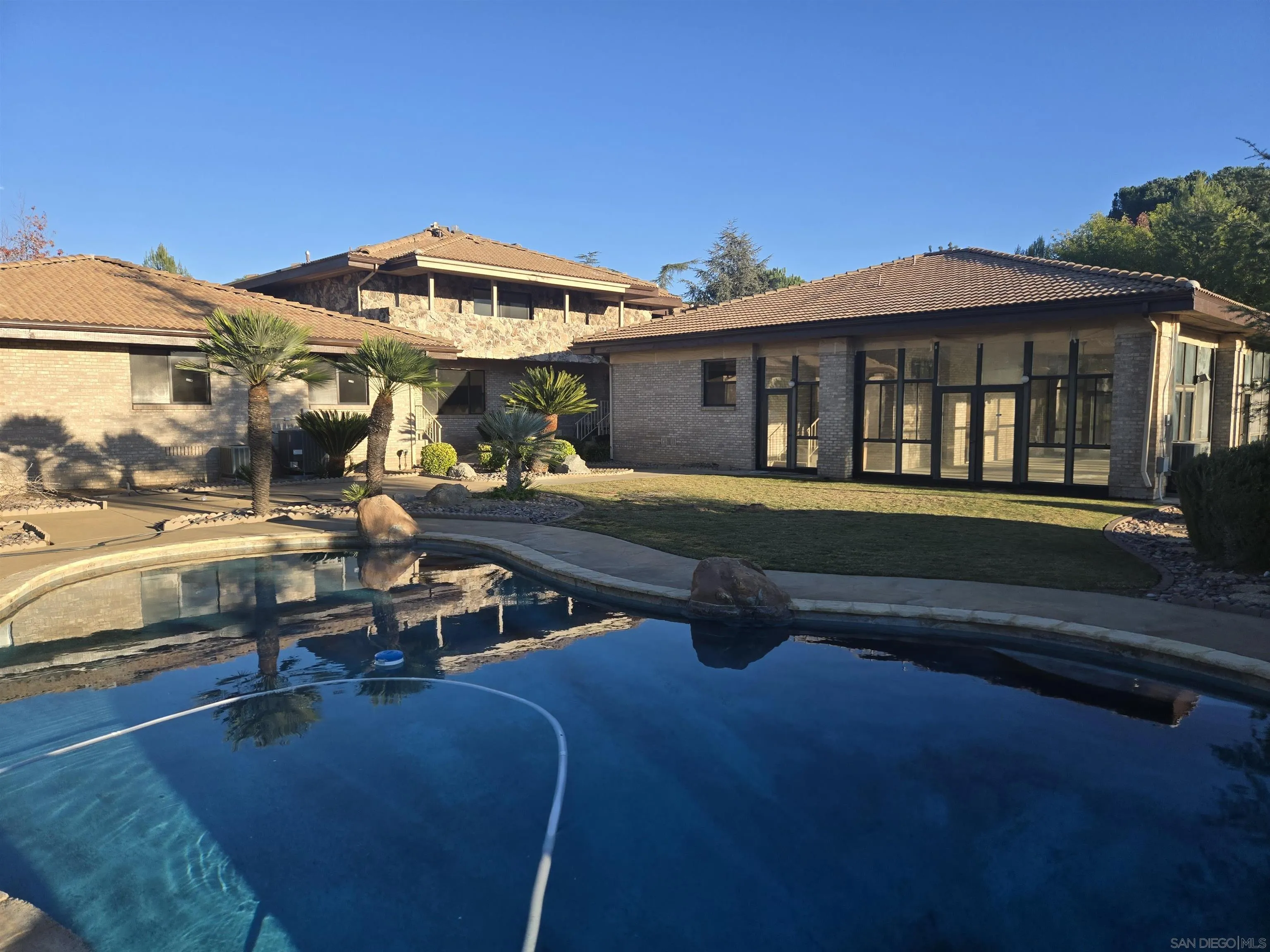 3725 Via Cielo Azul Alpine, CA 91901 - Photo 22 of 37 a view of a house with pool and chairs
