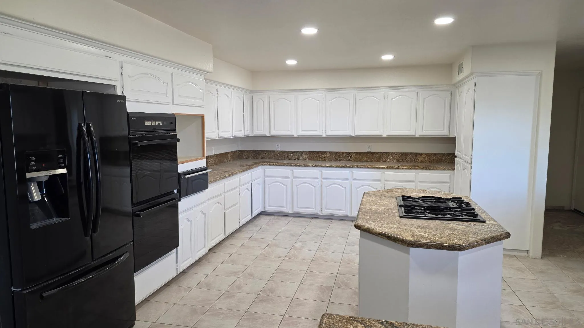 3725 Via Cielo Azul Alpine, CA 91901 - Photo 10 of 37 a kitchen with stainless steel appliances granite countertop a refrigerator and a stove top oven