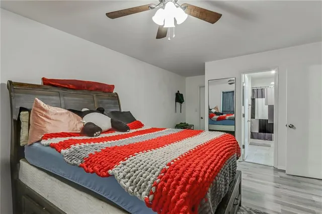 a bed room with a bed and a chandelier