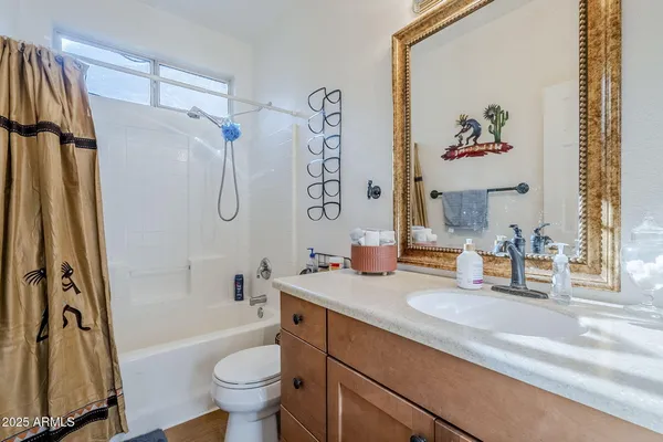 a bathroom with a bath tub with a shower