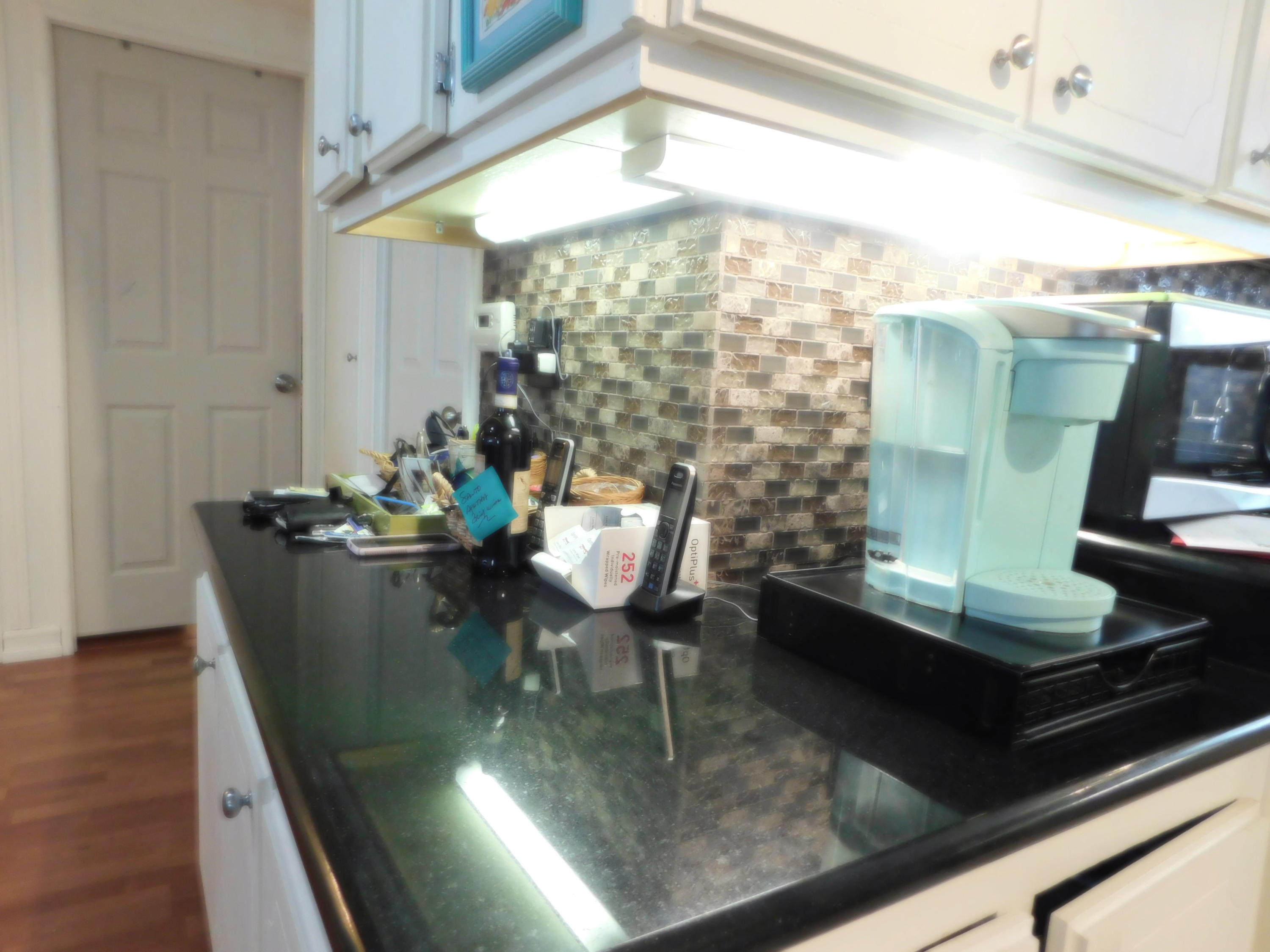 51555 Monroe Street, Unit 52 Indio, CA 92201 - Photo 12 of 42 a view of a dining room with furniture a chandelier and wooden floor