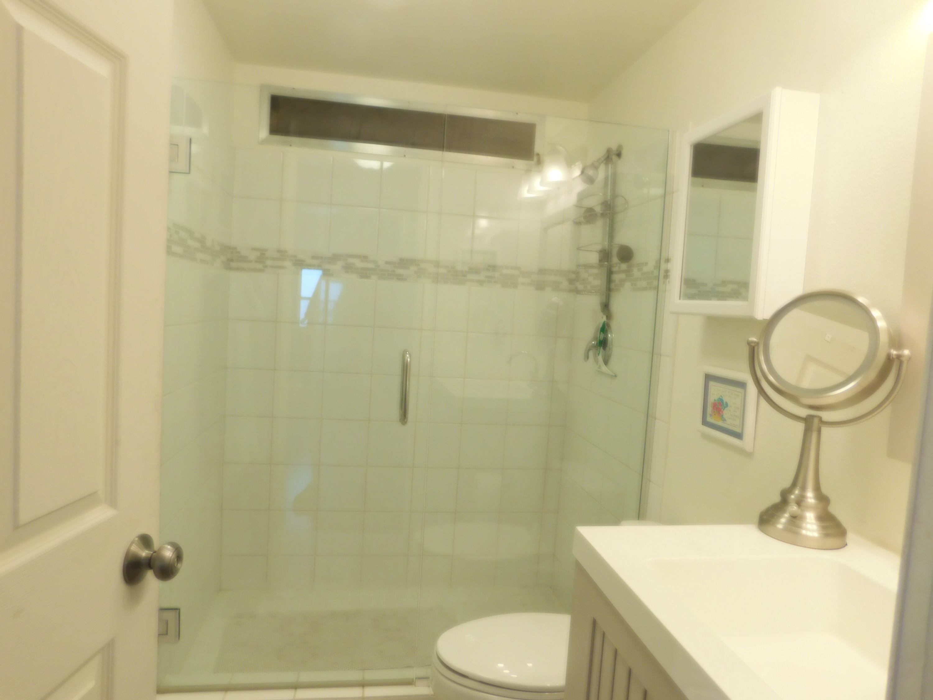 51555 Monroe Street, Unit 52 Indio, CA 92201 - Photo 13 of 42 a bathroom with a sink toilet and shower