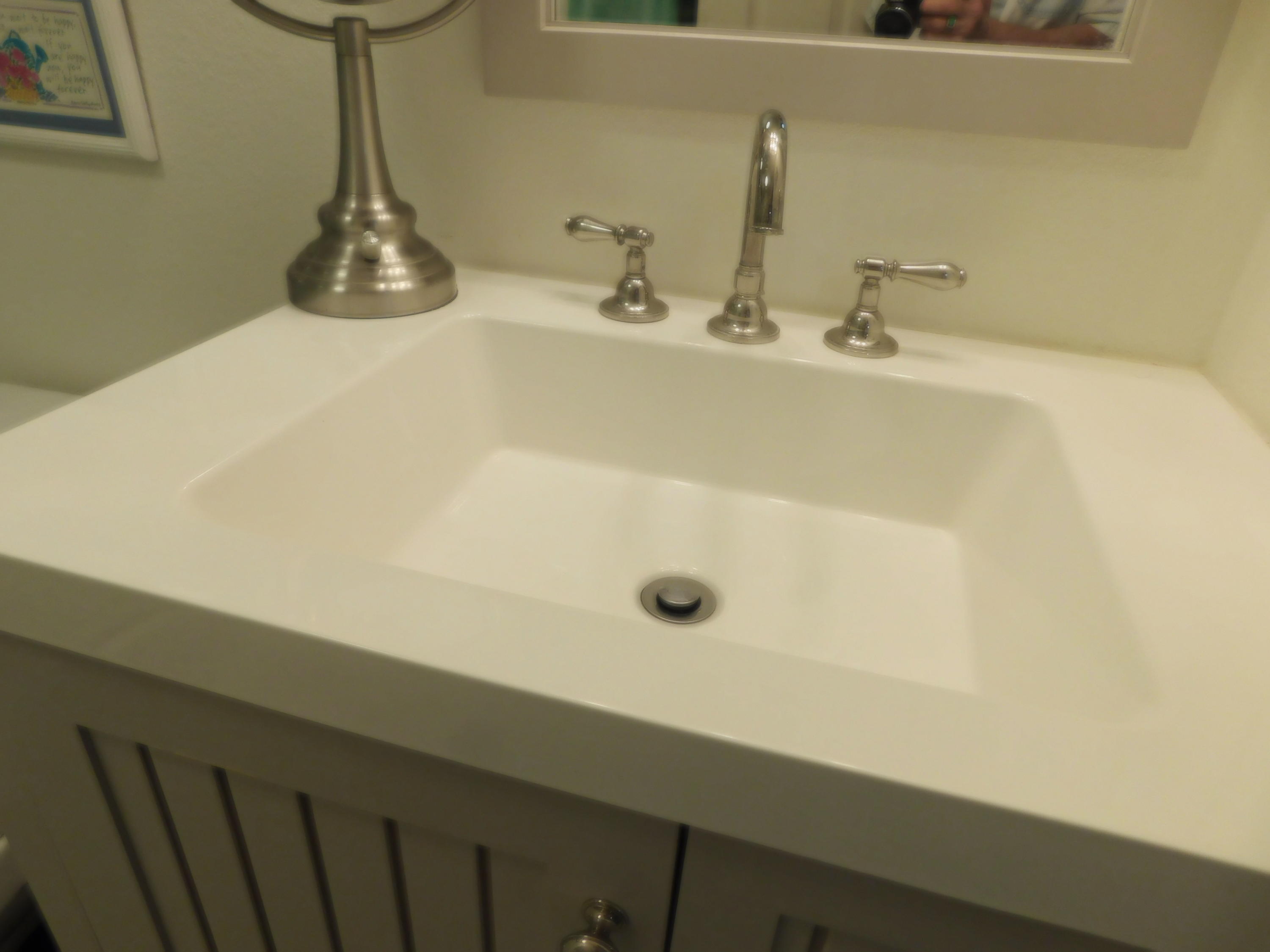 51555 Monroe Street, Unit 52 Indio, CA 92201 - Photo 14 of 42 a bathroom with a sink and a wooden floor